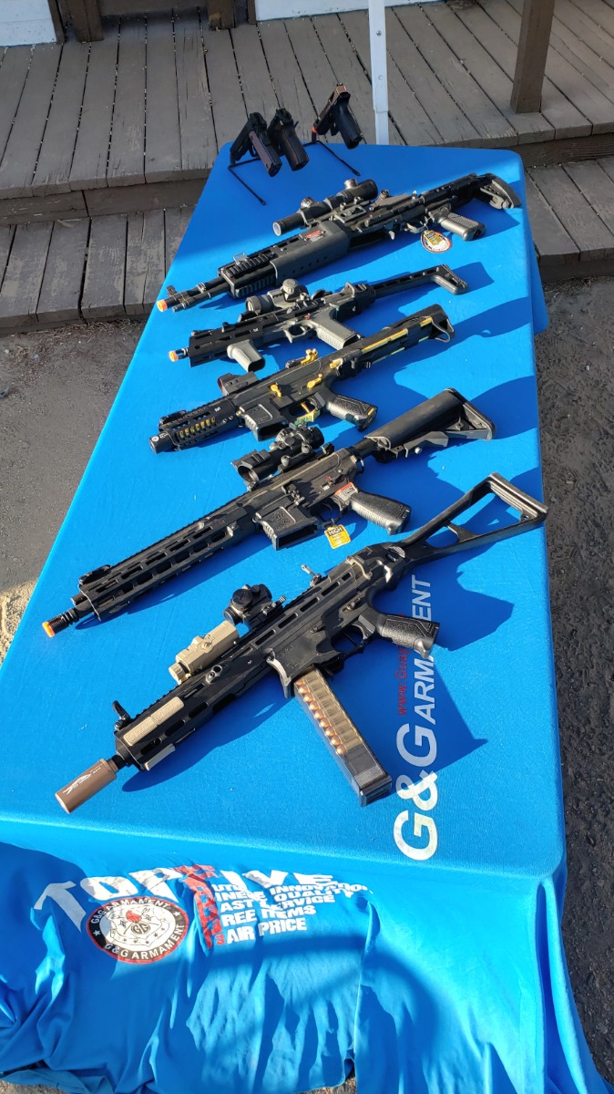 Second set of rifles on display, with pistols in the back